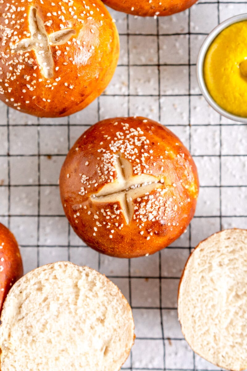 baked bun with salt on top on a wire rack