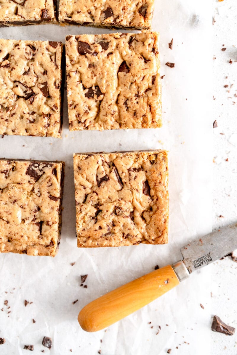 square of cookie bar with knife