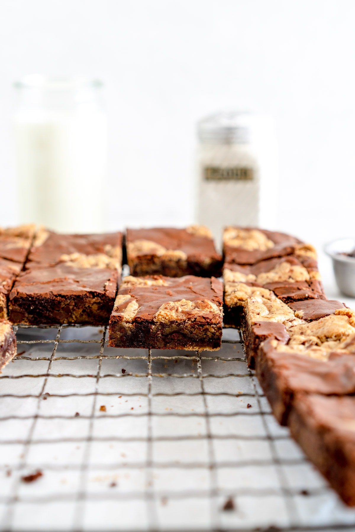 side shot of brownie cookie bars on a wire rack