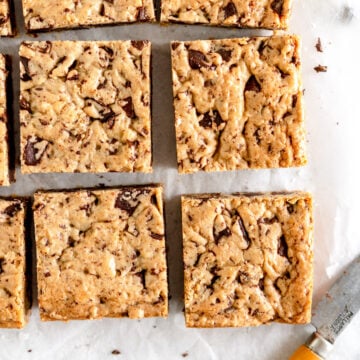 chocolate chip cookie bars on wax paper.