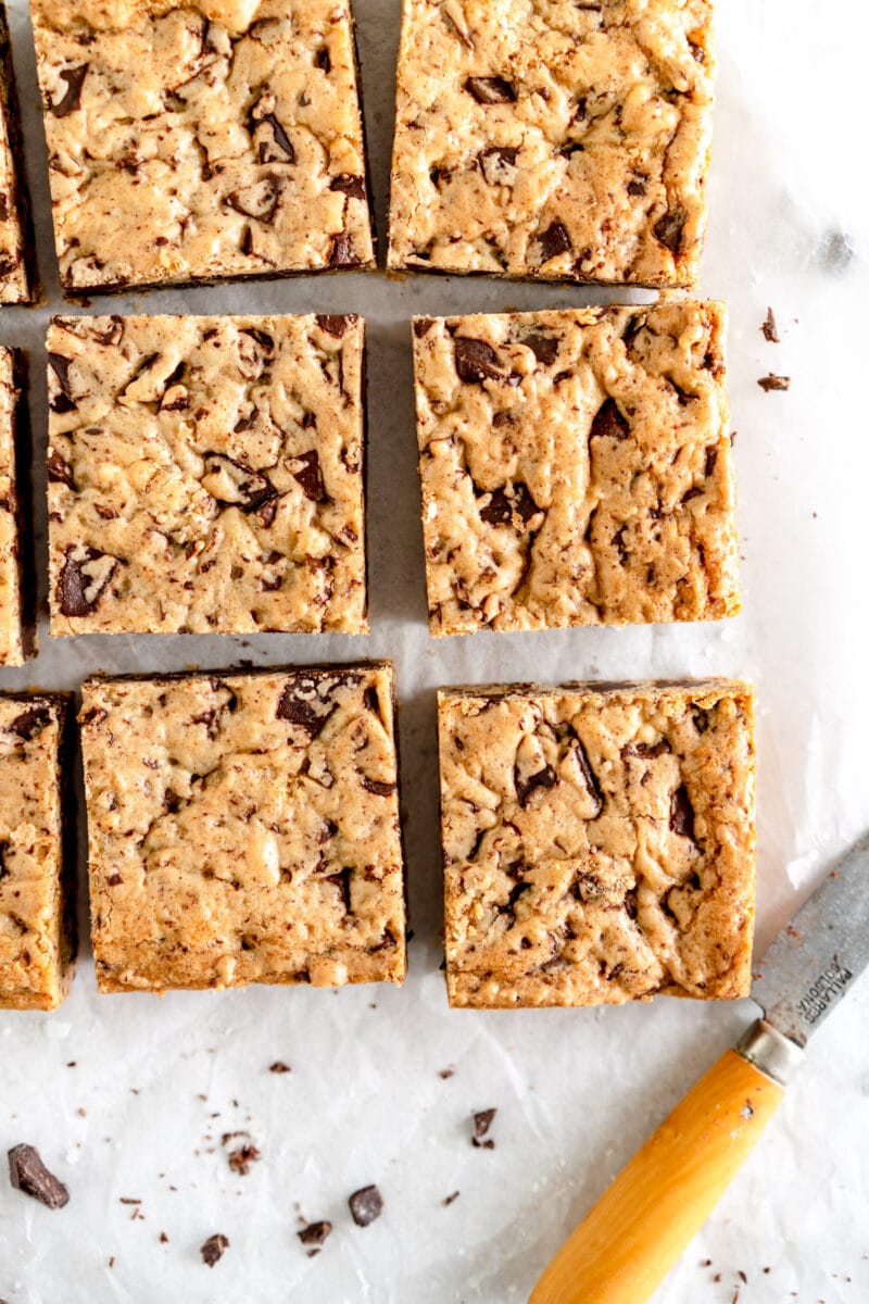 chocolate chip cookie bars on wax paper.