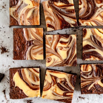 cheesecake brownies on wax paper