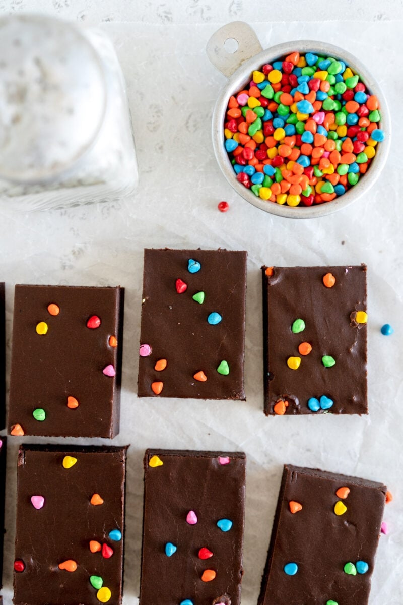cosmic brownie sliced on paper with sprinkles