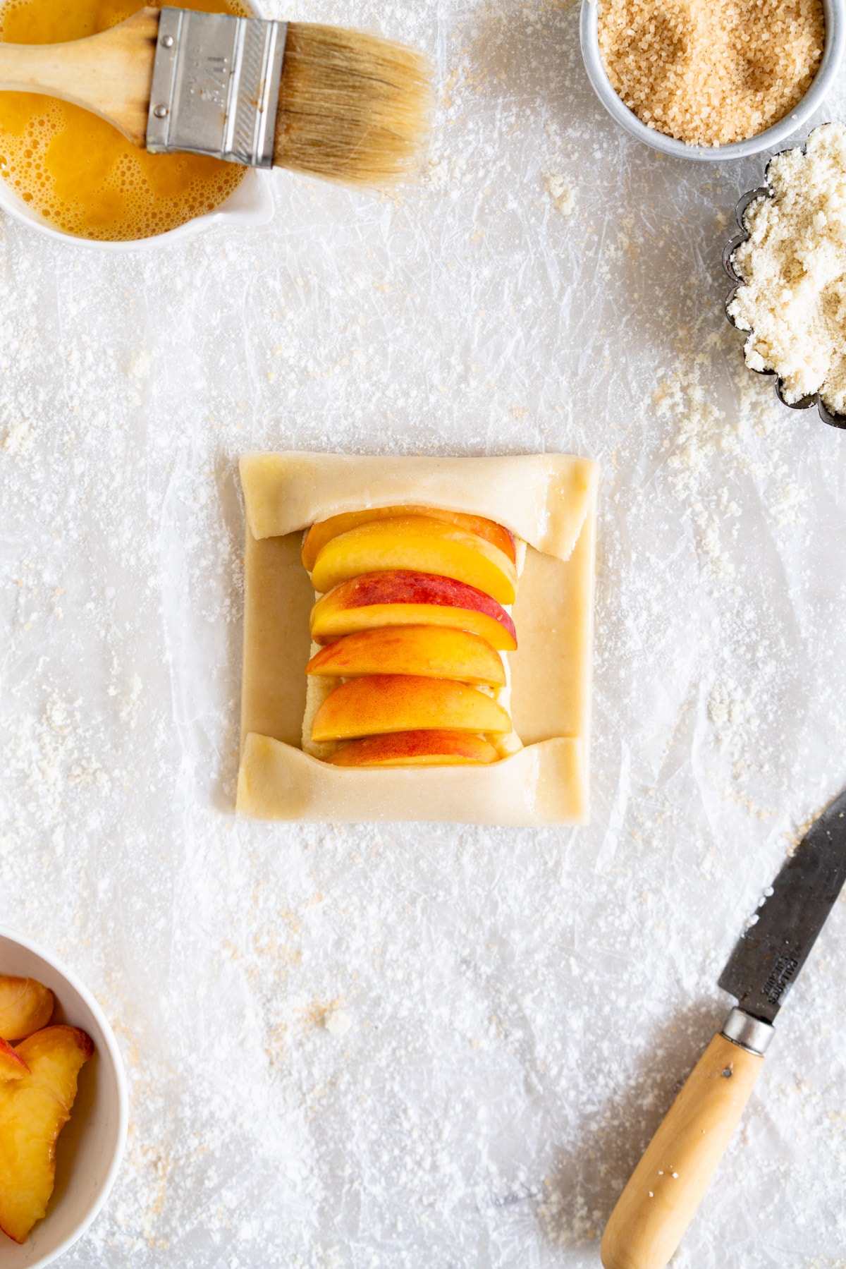 folded pastry with peaches and frangipane