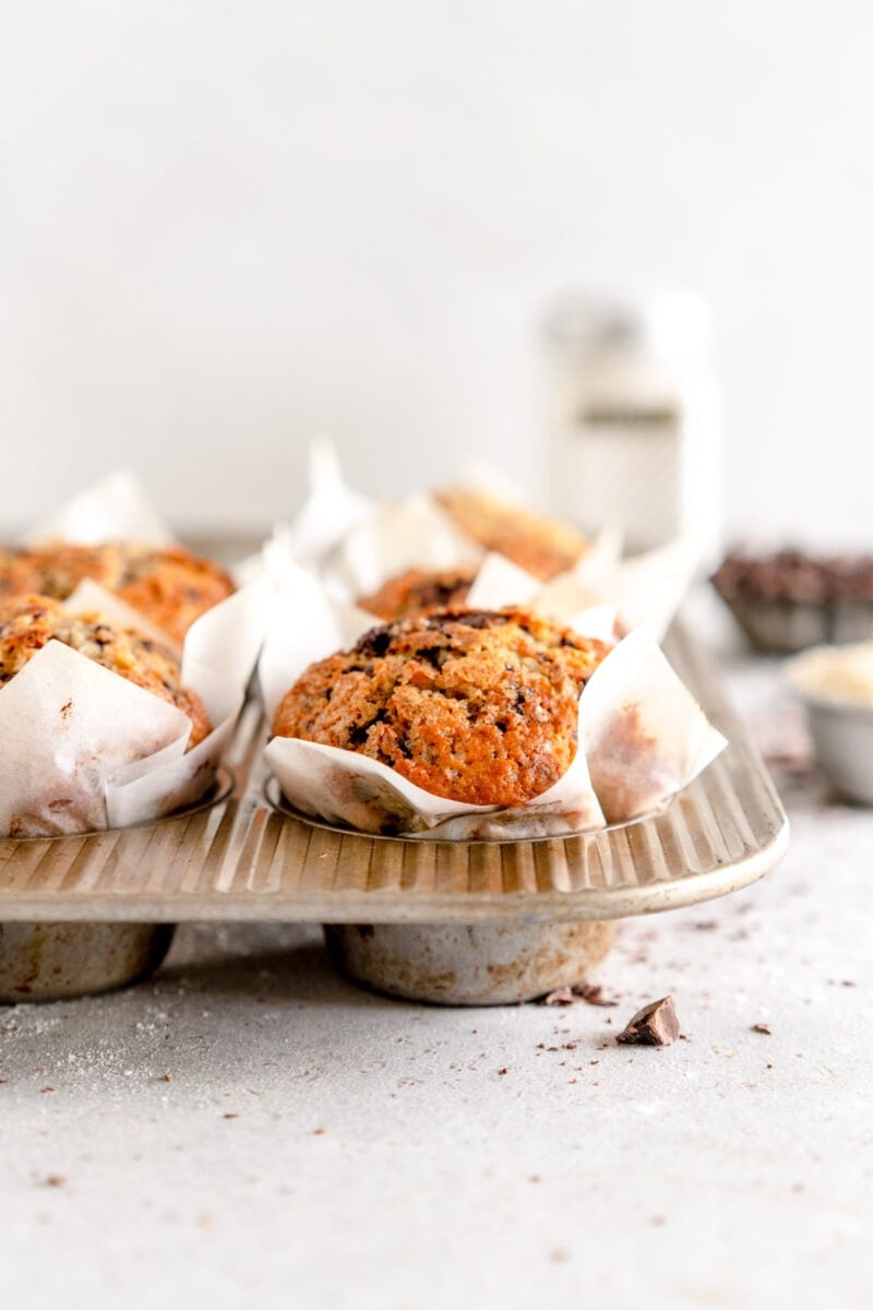 baked banana chocolate chip muffin in muffin pan
