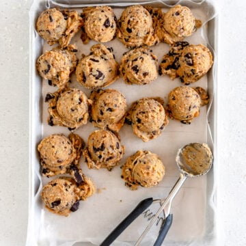 balls of cookie dough on sheet pan