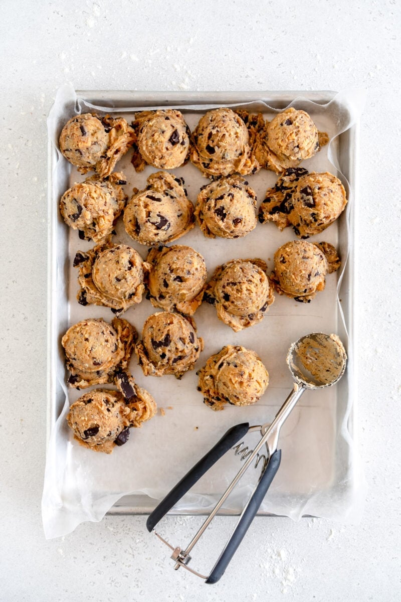 balls of cookie dough on sheet pan