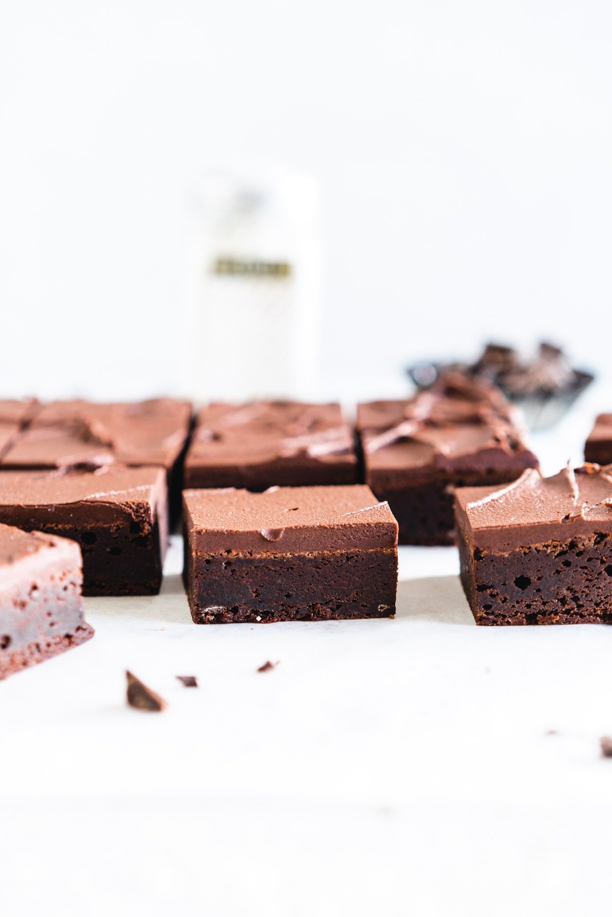 slice of brownie with frosting on top