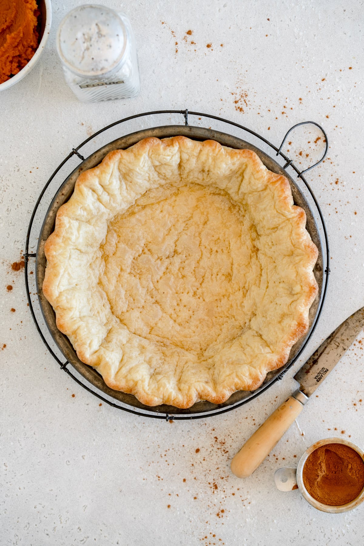 par baked pie crust on rack