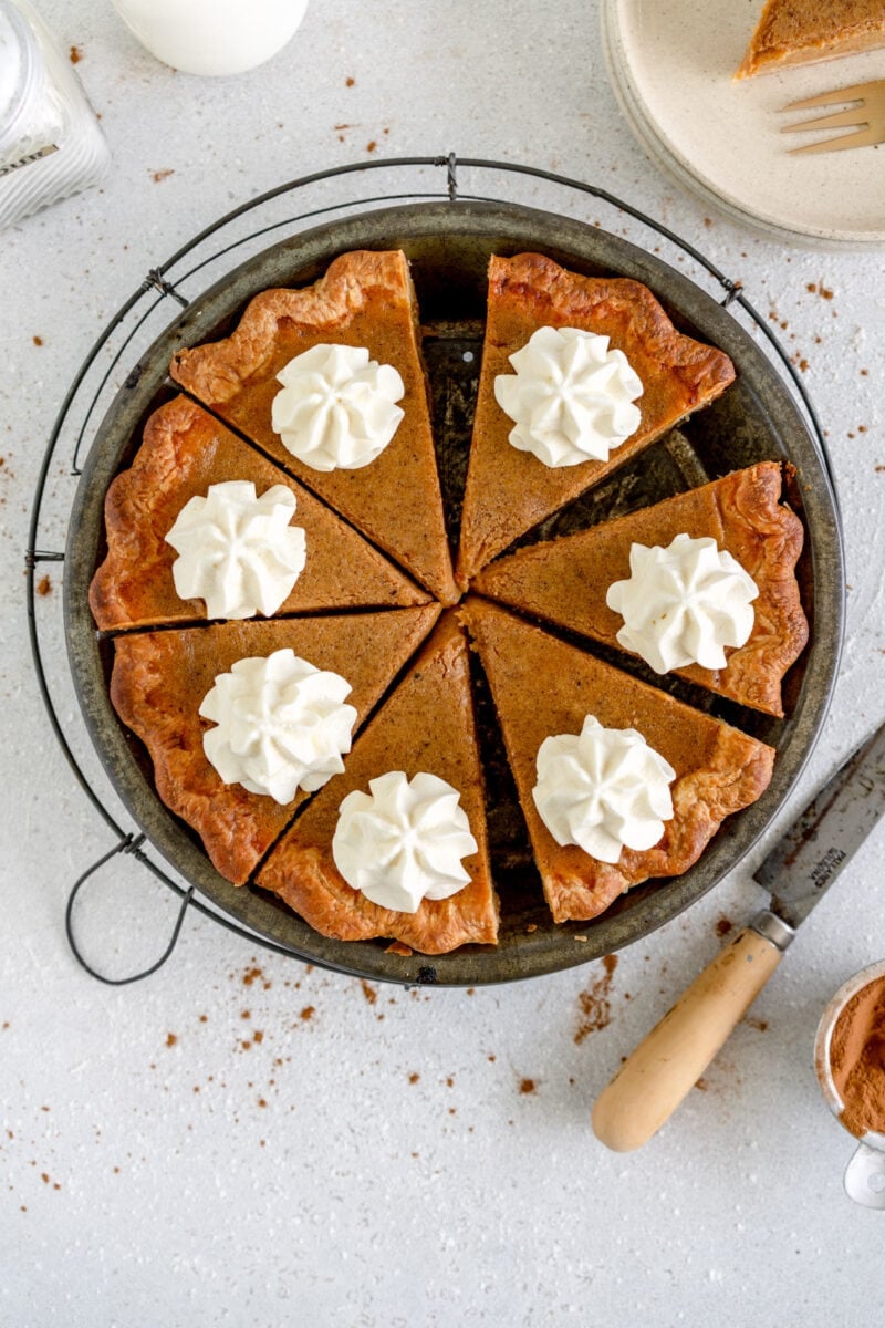 slices of pumpkin pie in a pie pan
