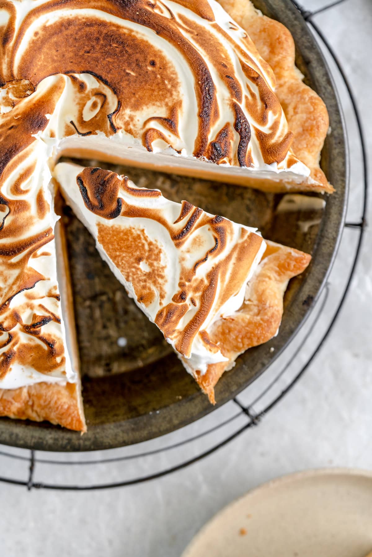 close up of lemon meringue pie in pan