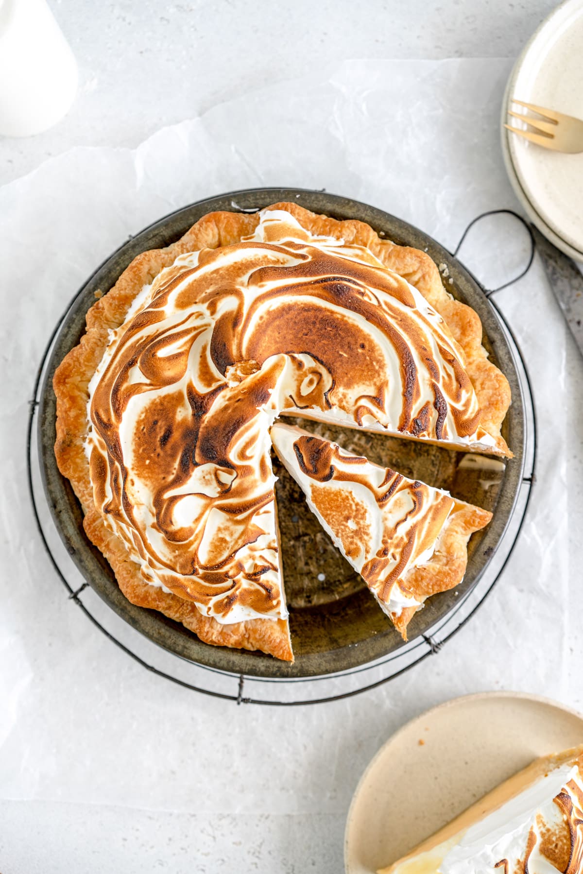 lemon meringue pie with slice taken out