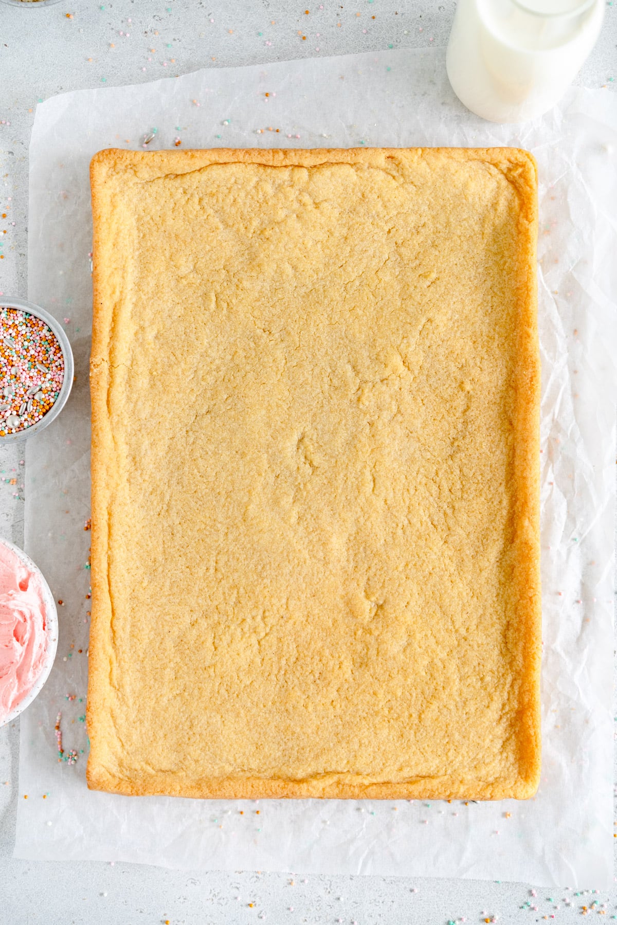 baked sugar cookie bar on parchment paper
