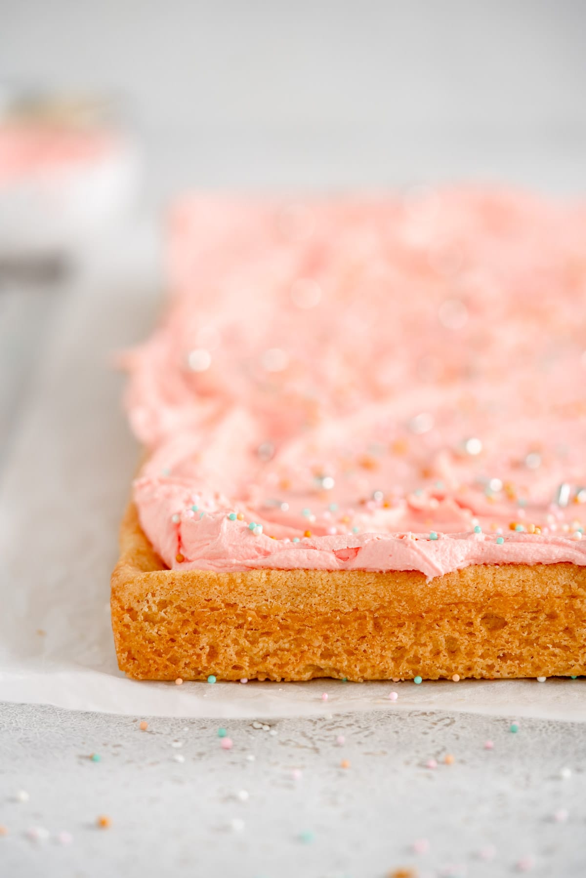 end shot of baked sugar cookie bars with frosting