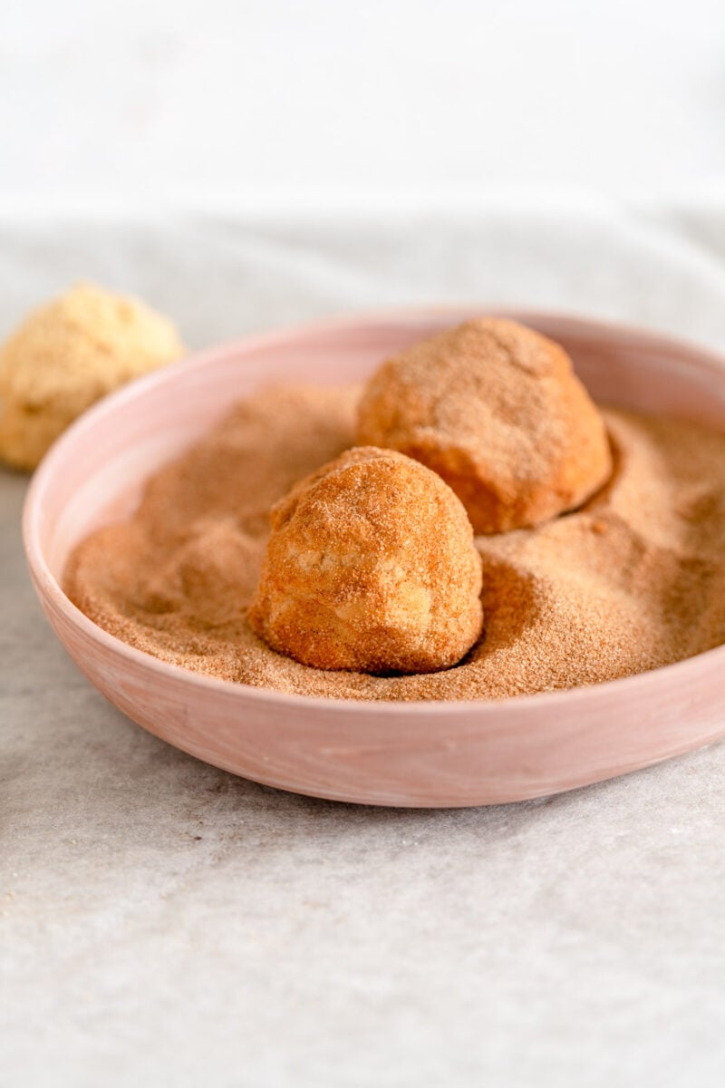 balls of cookie dough rolled in cinnamon sugar