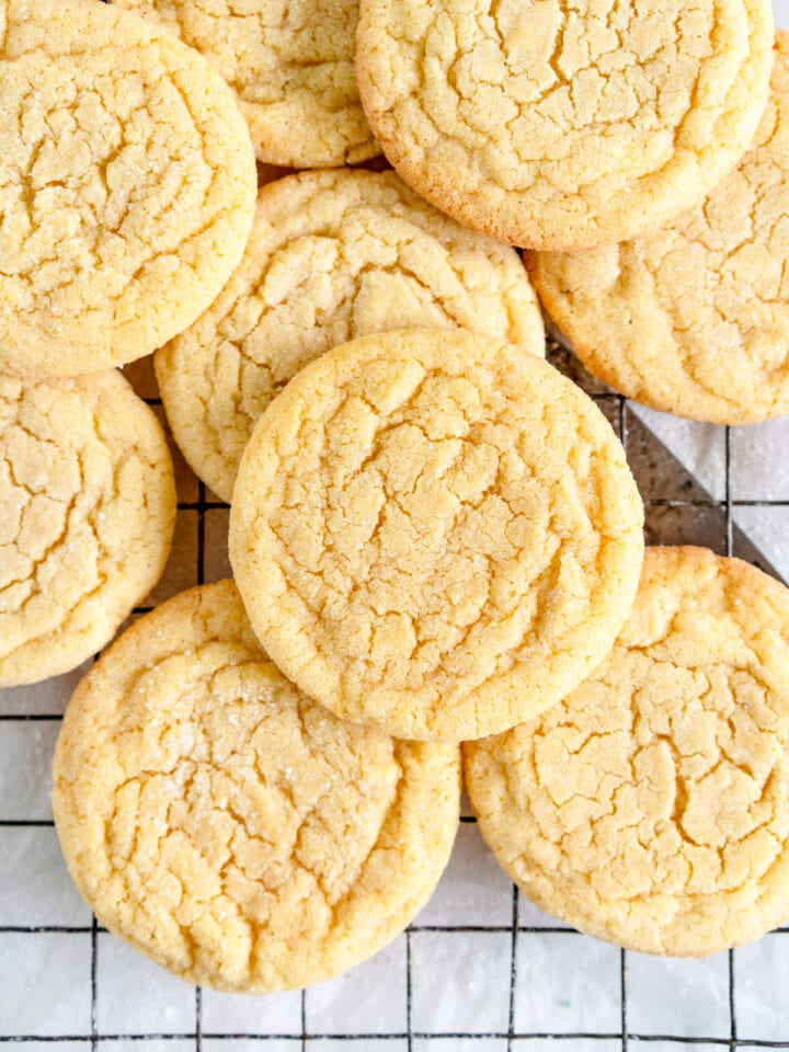 vanilla sugar cookies stacked on wire rack