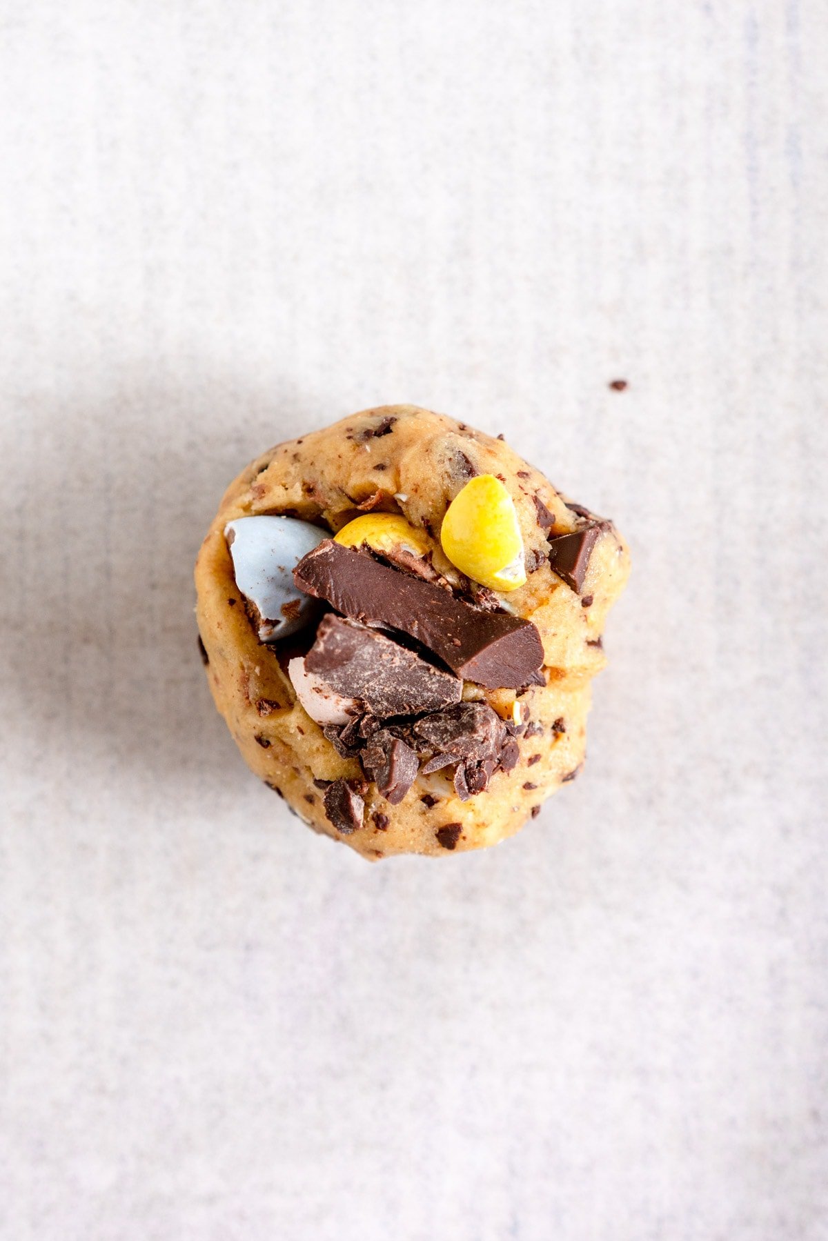 ball of cookie dough with mini eggs on top