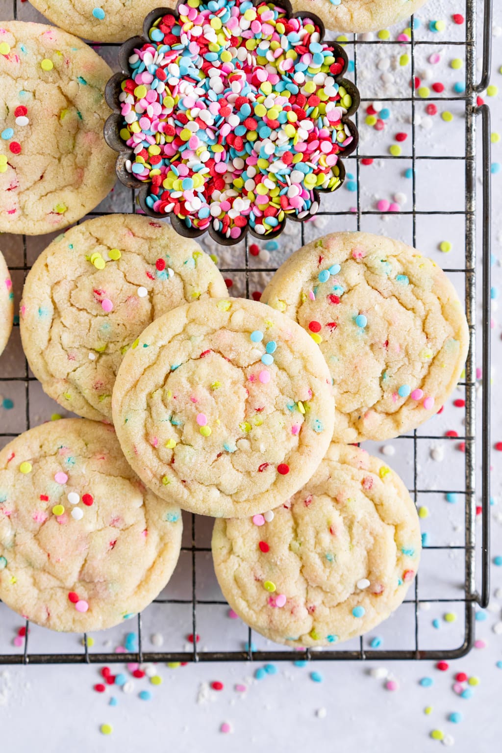 cookies with sprinkles on a wire rack