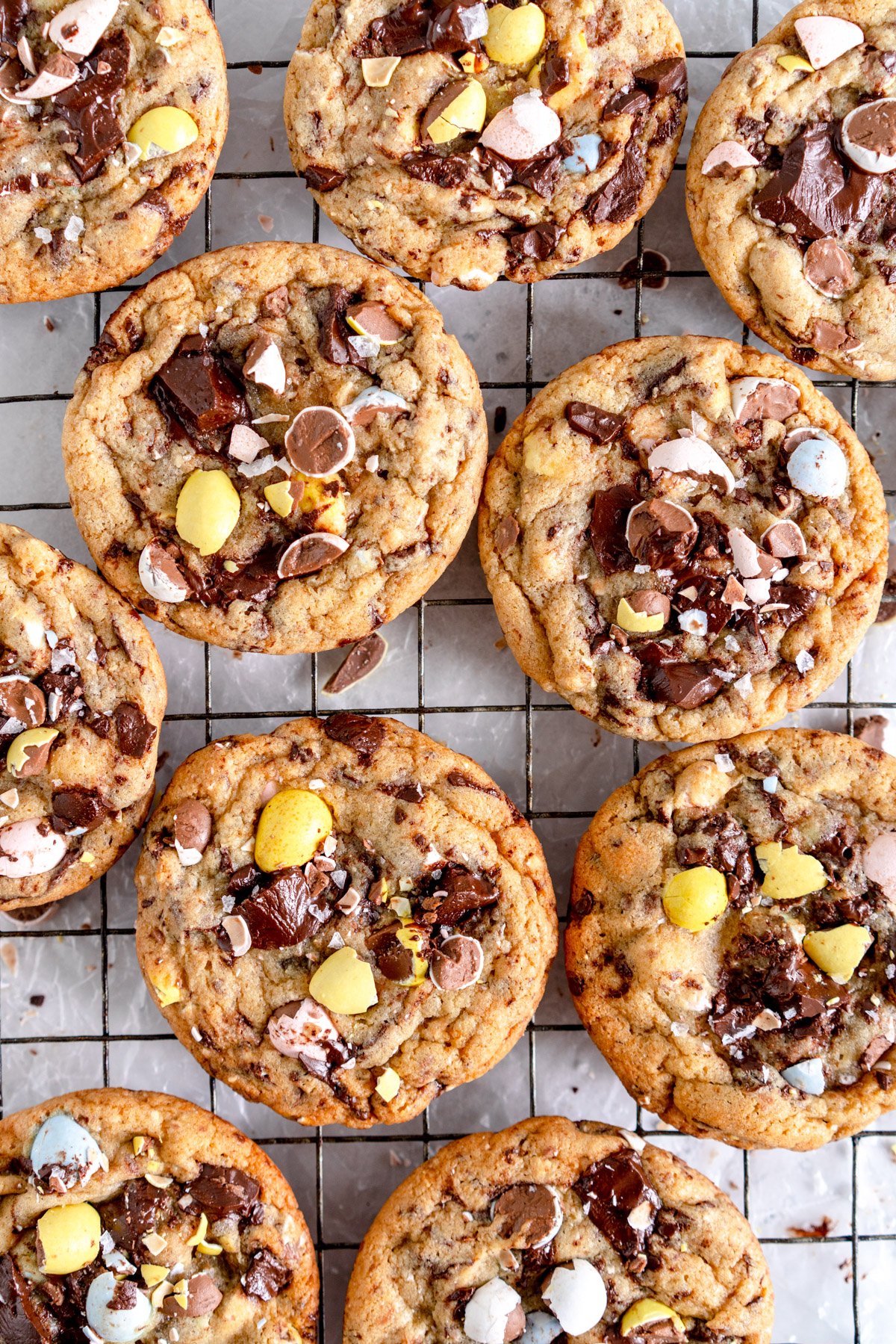 close up image of baked mini egg chocolate chip cookies