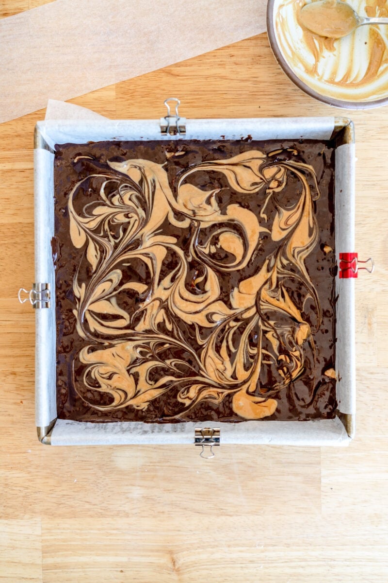 peanut butter swirled on top of brownie batter