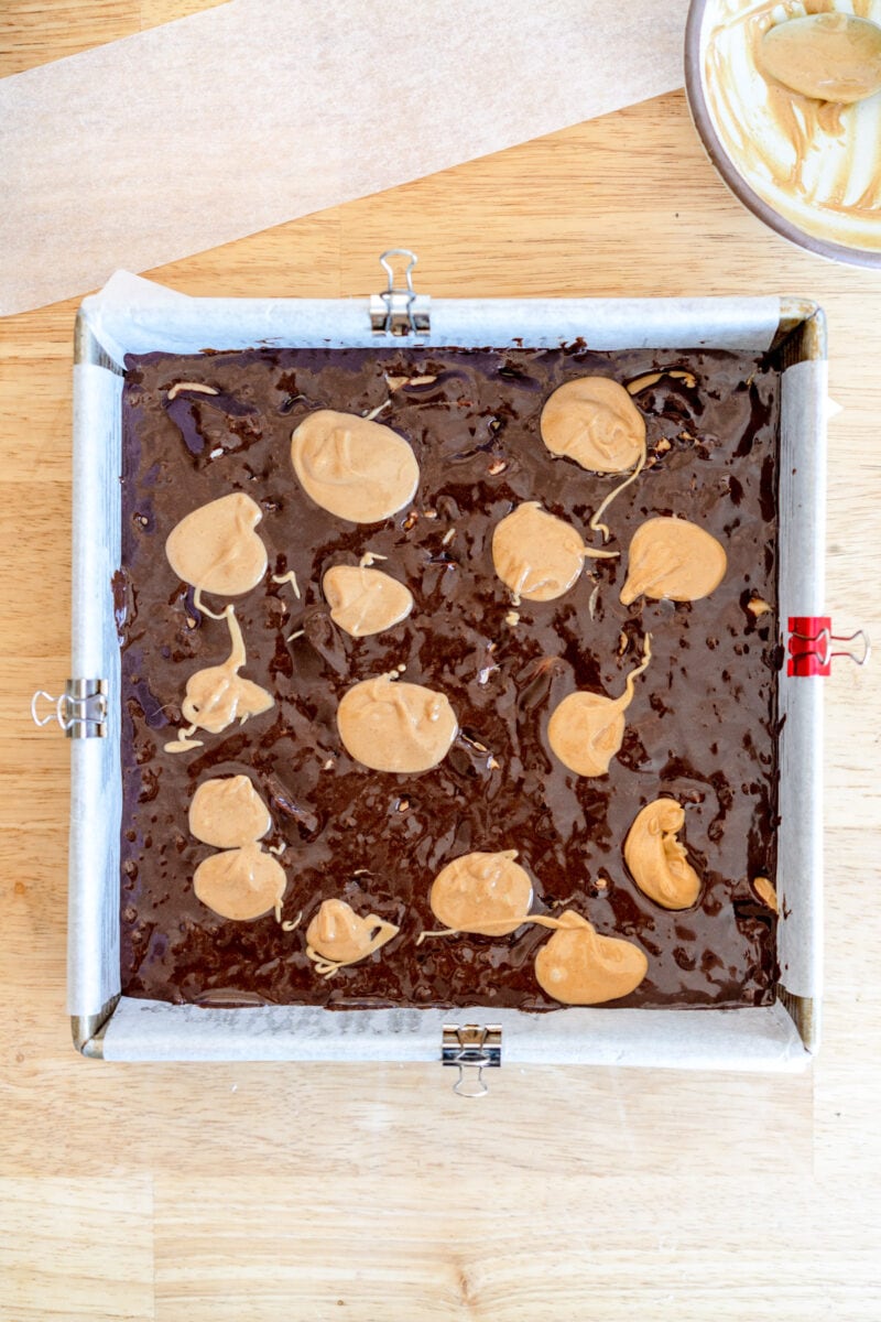 Peanut butter swirl on top of brownie batter