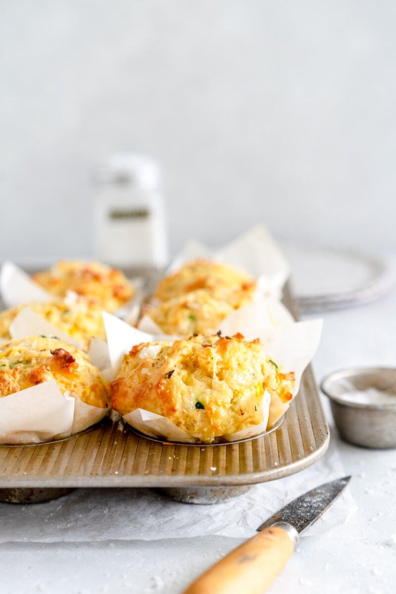 baked zucchini muffins in muffin pan