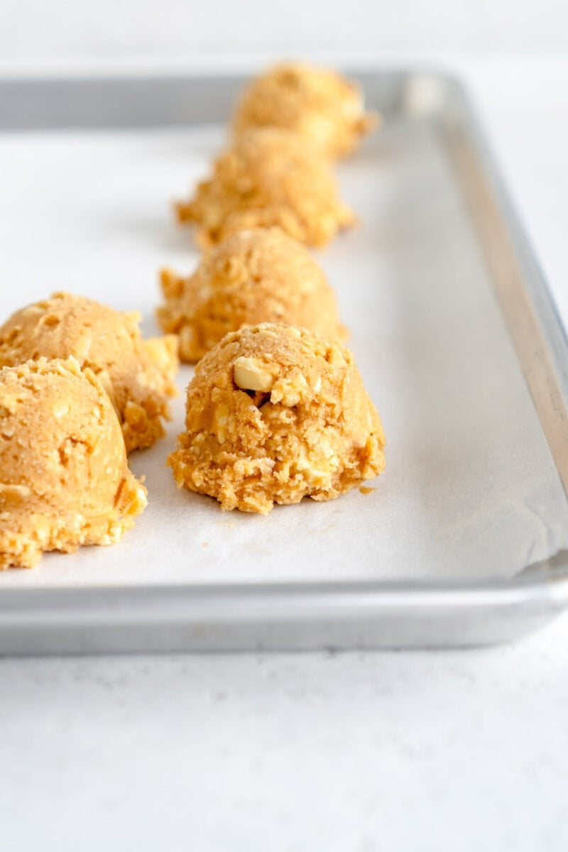 side on ball of white chocolate chip cookie dough