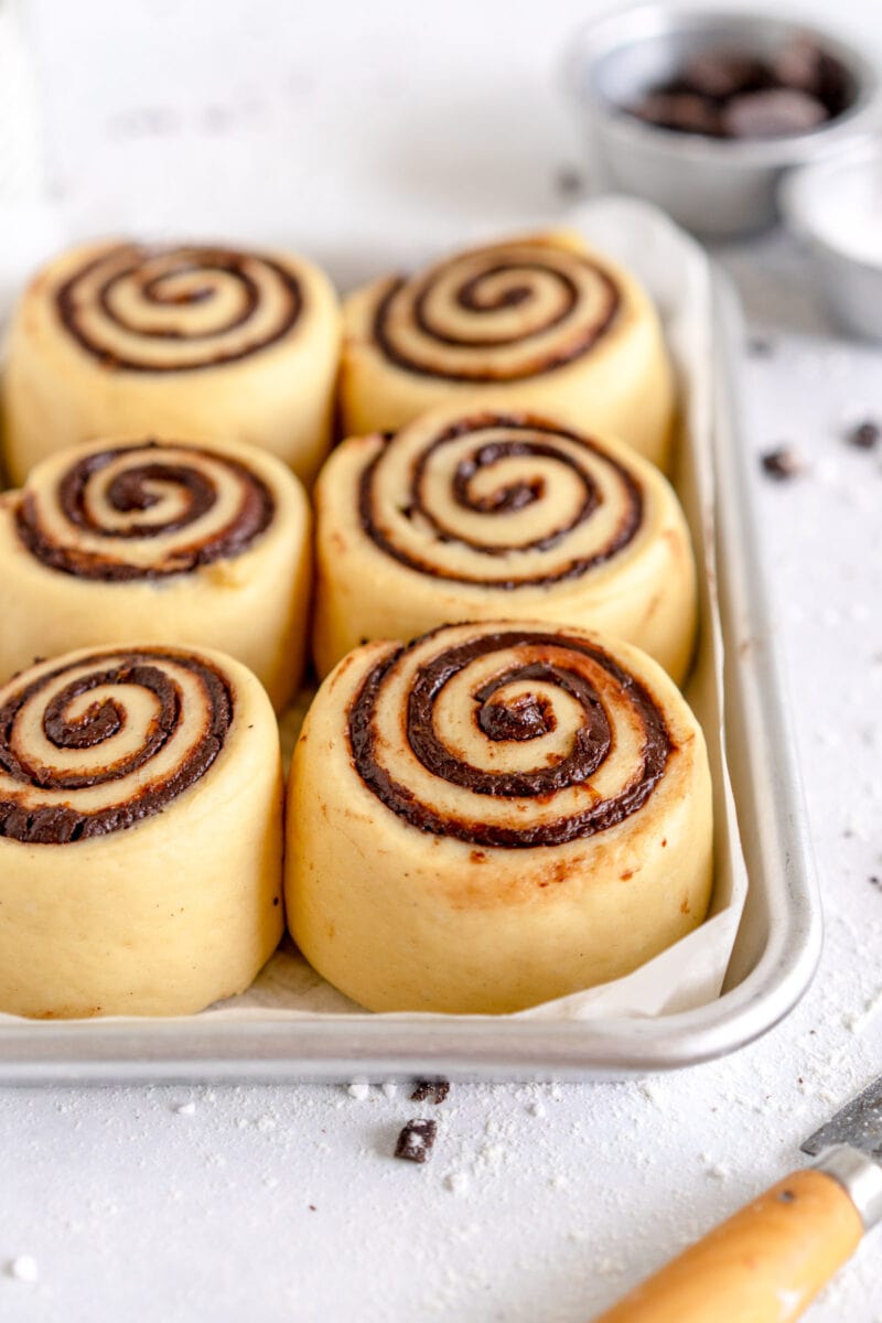 risen orange rolls ready to bake