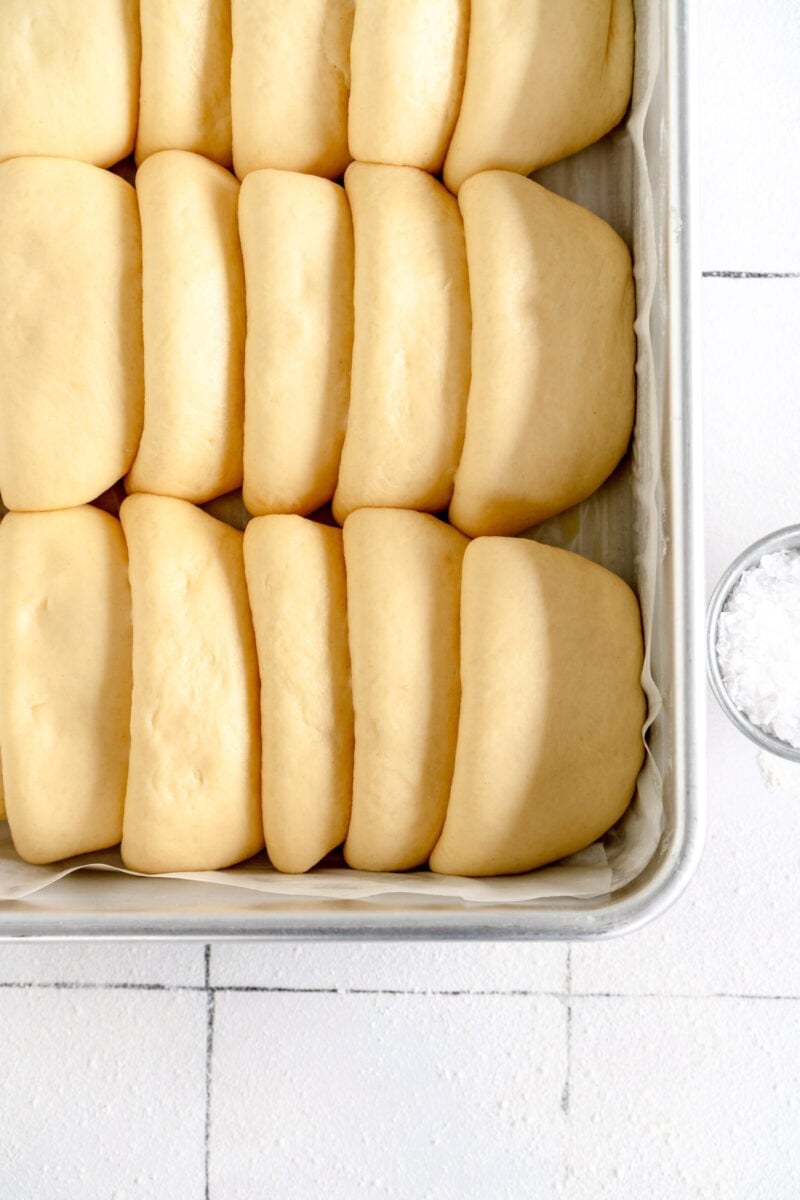 risen rolls in pan