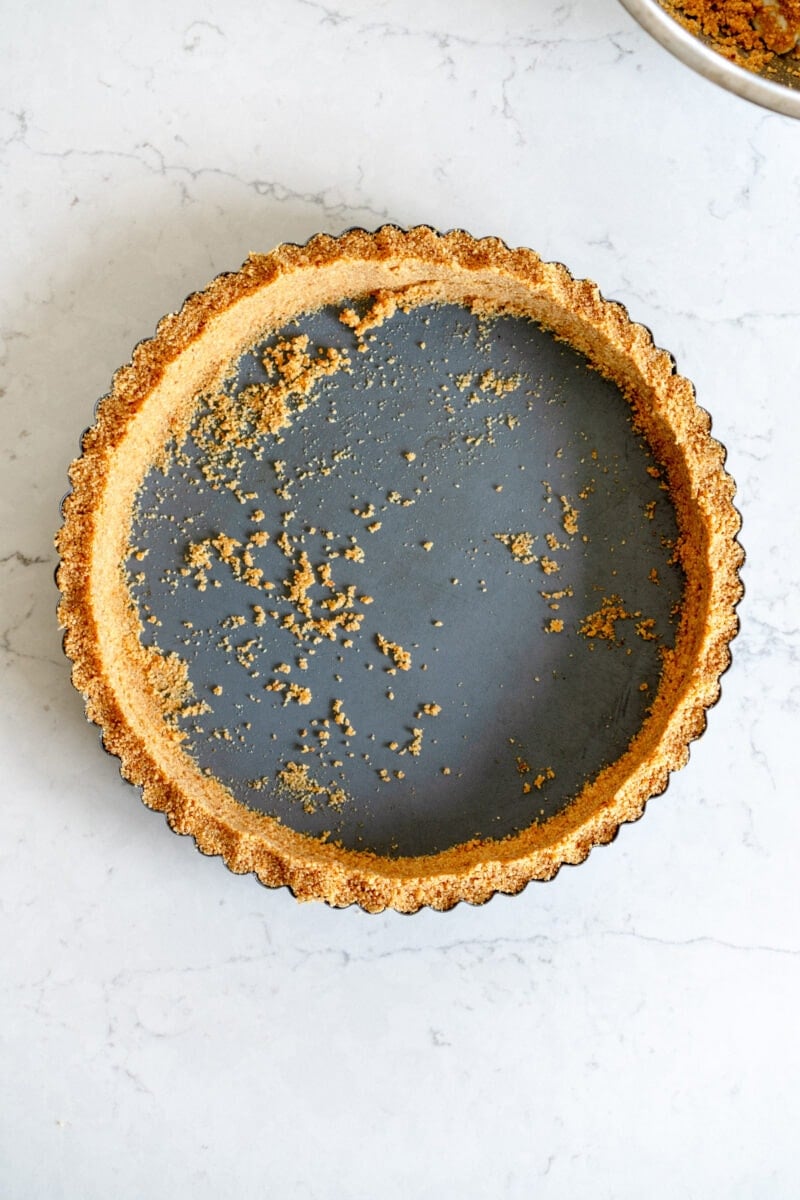 graham cracker crust in a tart pan