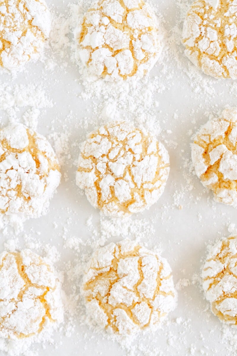 lemon crinkle cookies on parchment paper