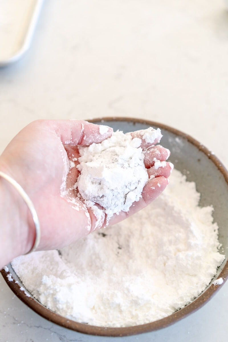 powdered sugar on red velvet cookies