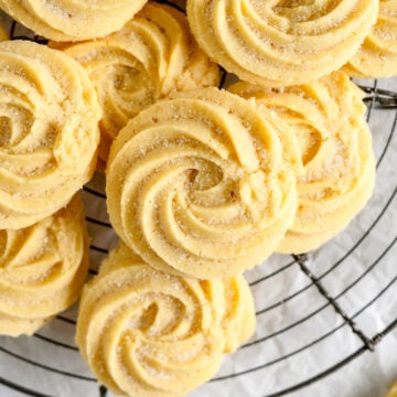 piped butter cookies on rack