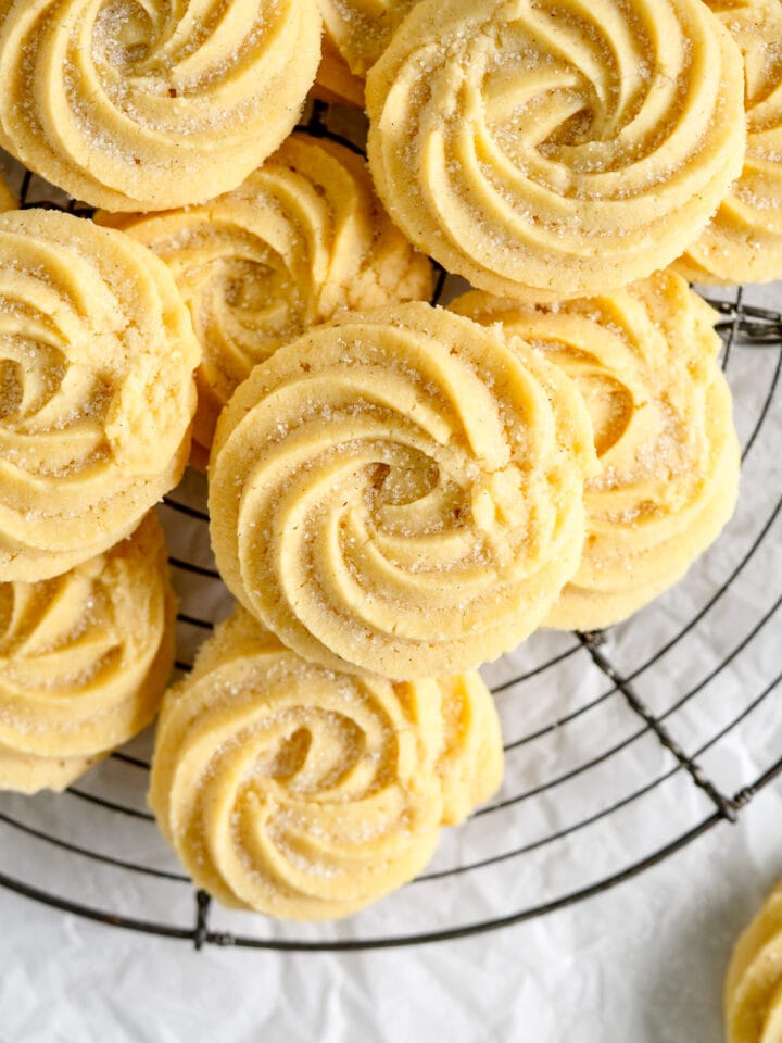 piped butter cookies on rack