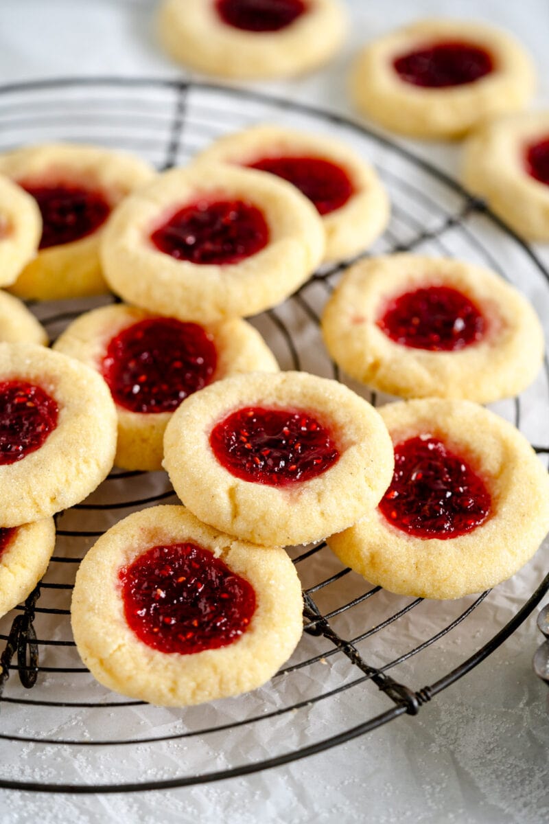 baked thumbprint cookies on wire rack