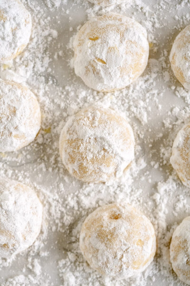 close up of snowball cookies with powdered sugar