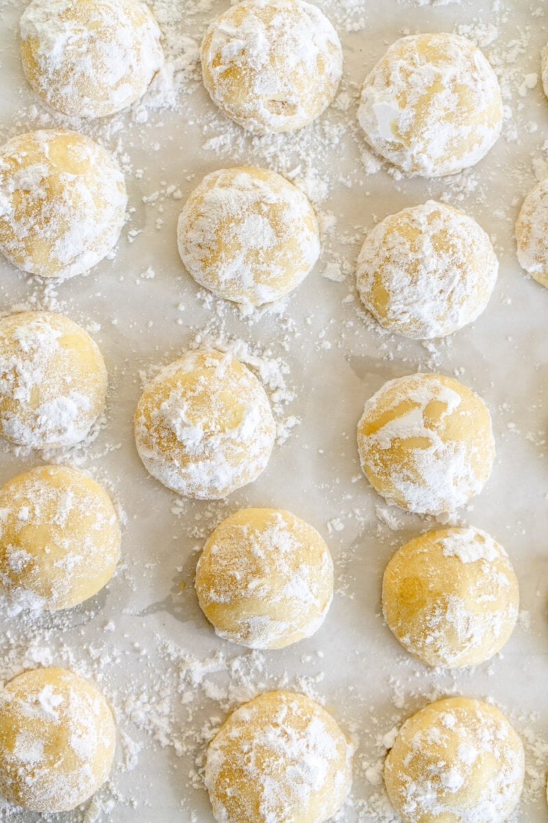 snowballs on pan with powdered sugar