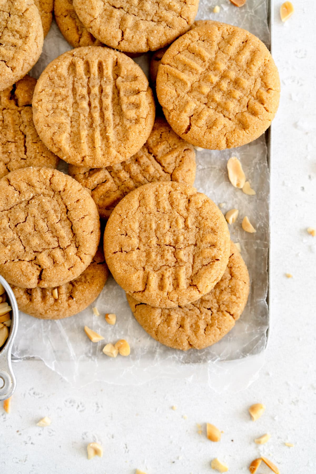peanut butter cookies on a pan with wax paper