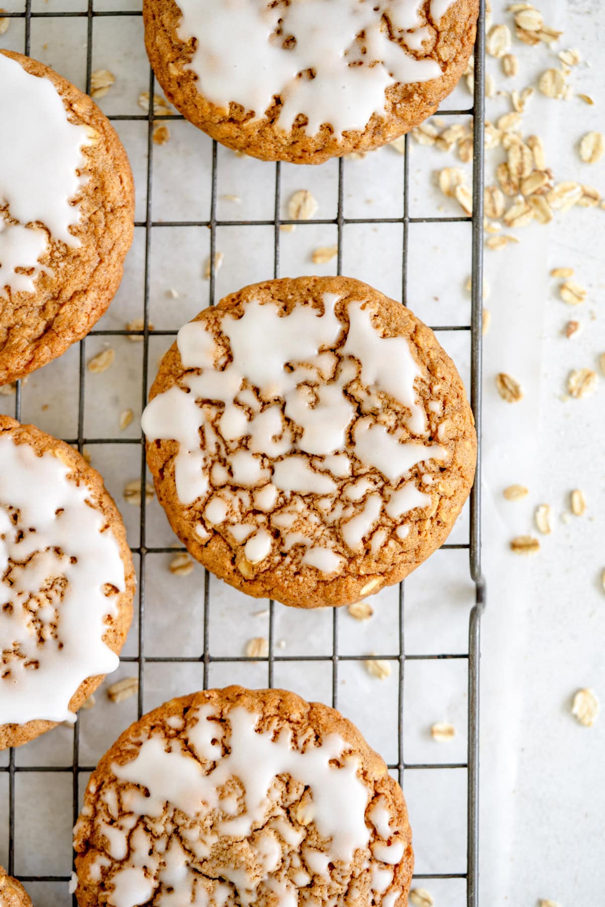 iced oatmeal cookie on baking rack