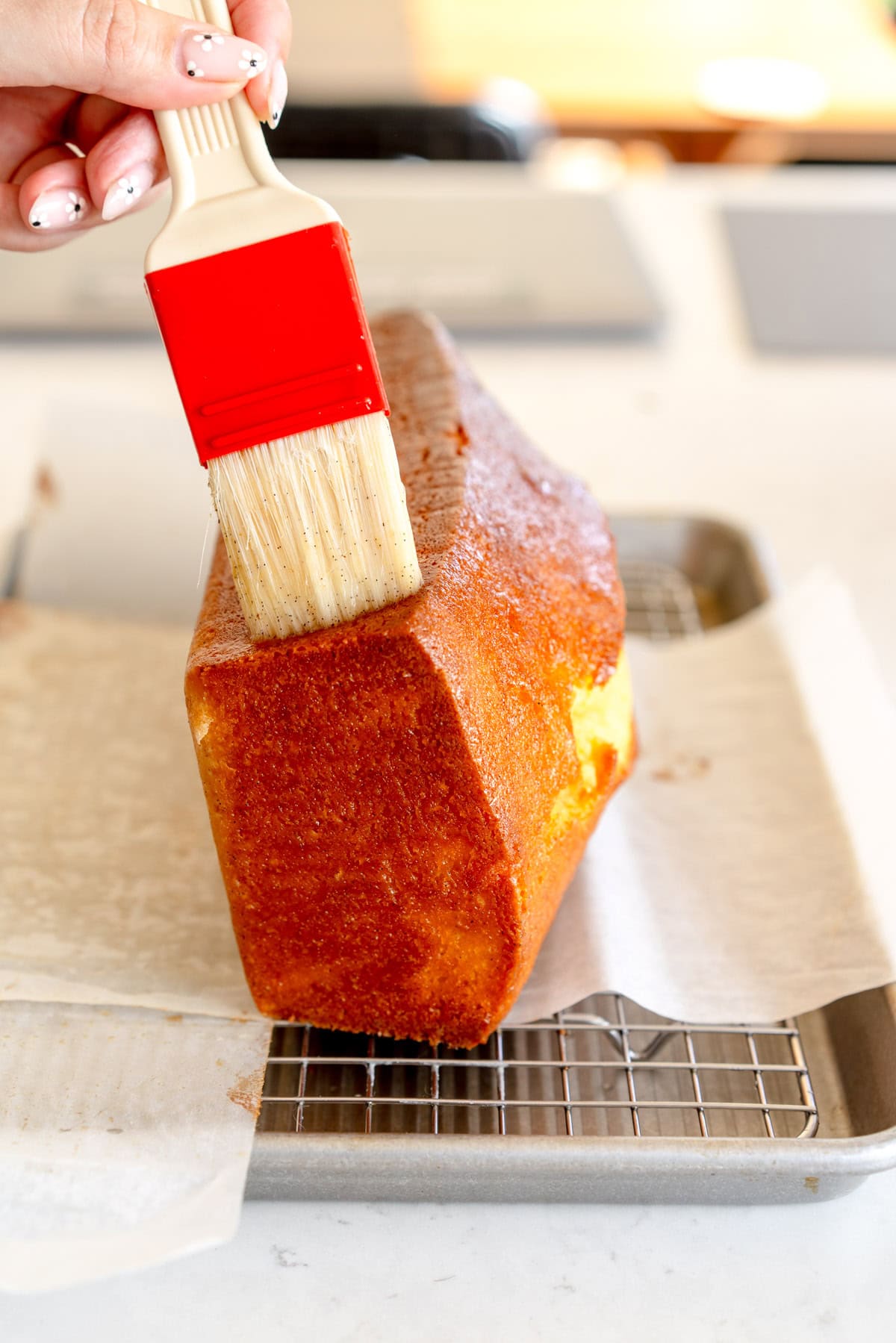 adding lemon soak to cake
