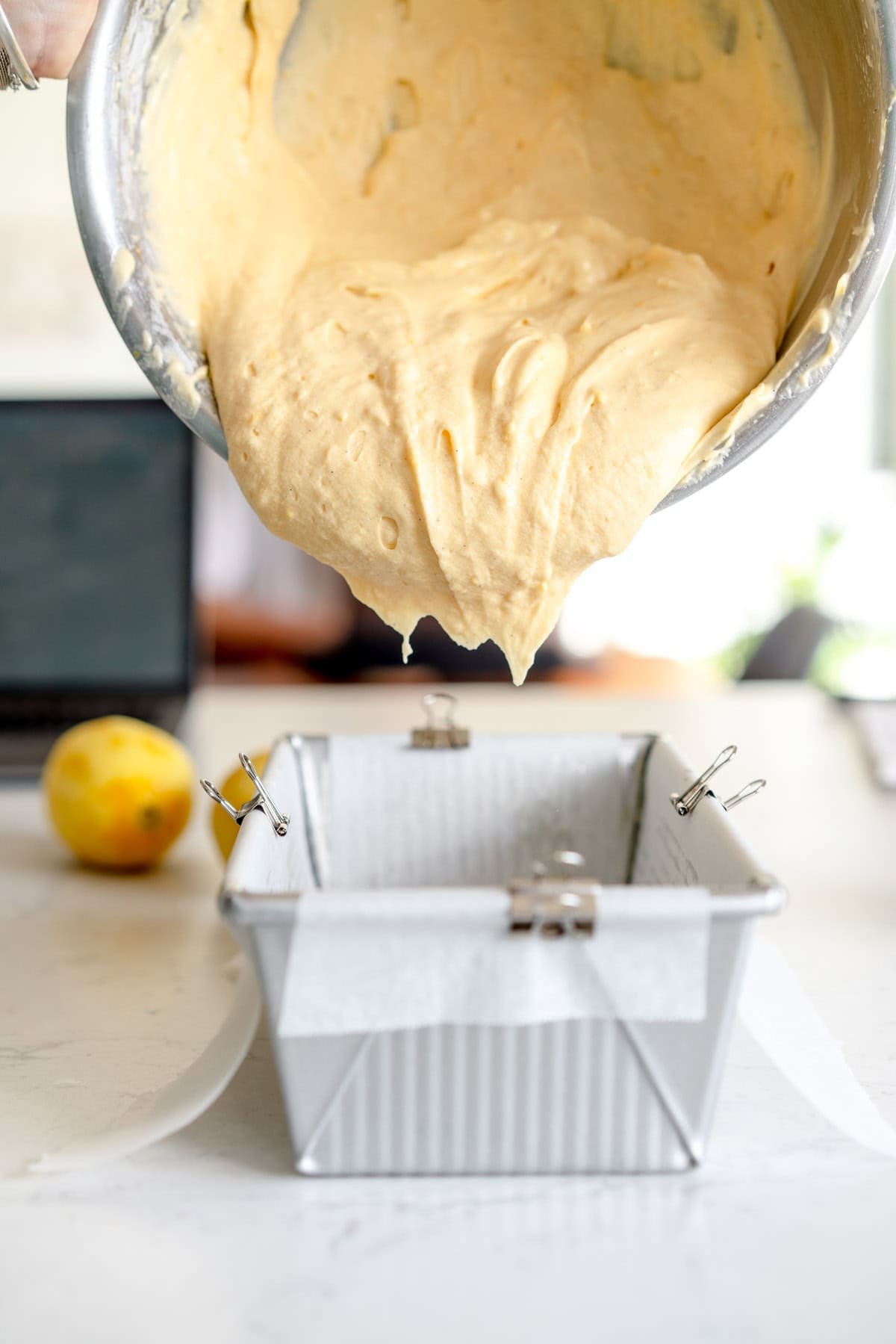 cake batter being added to pan