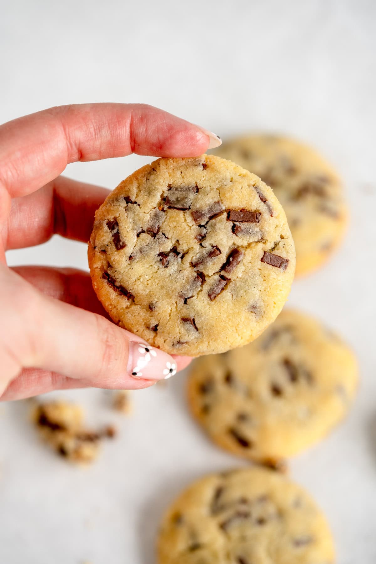 holding baked cookie